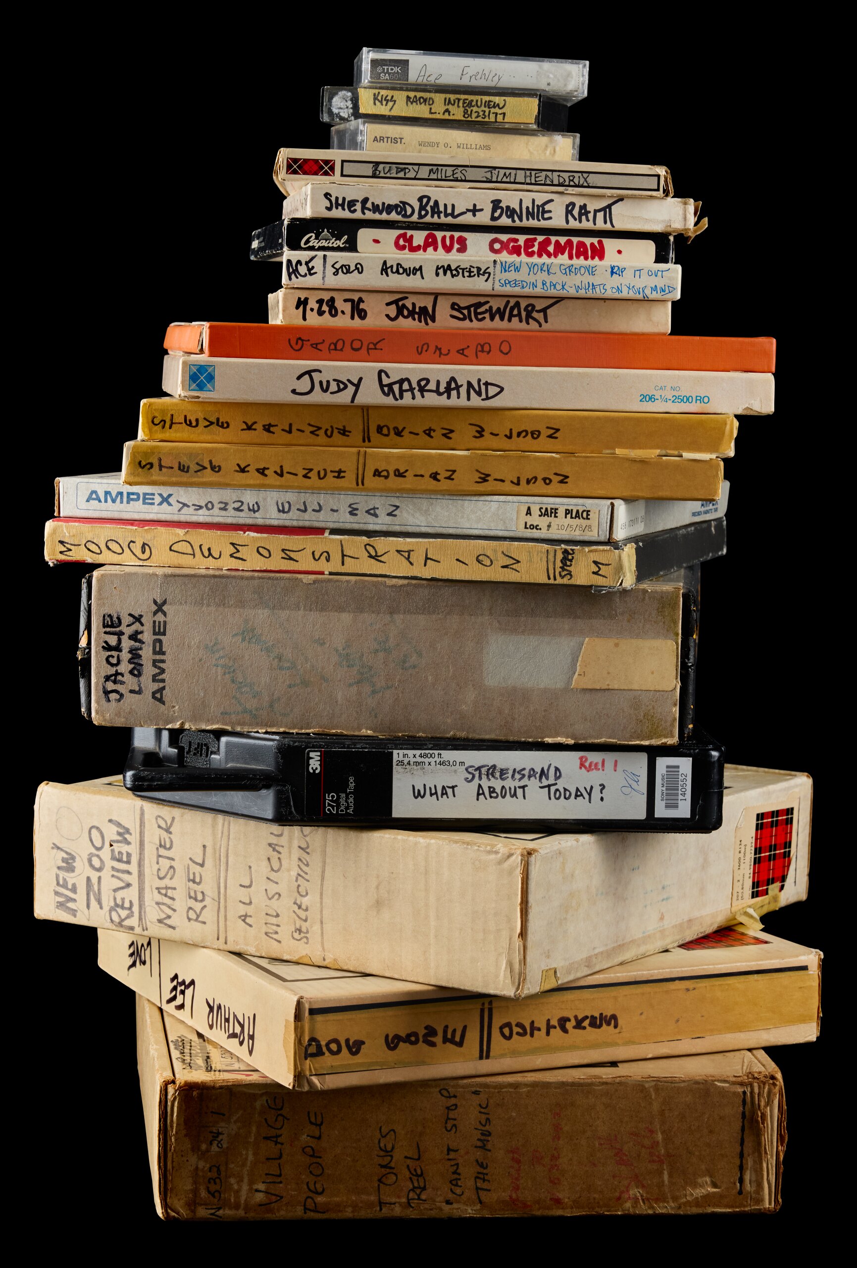 A stack of master tape boxes and cassettes